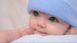 stock-footage-a-cute-little-baby-is-looking-into-the-camera-and-is-wearing-a-blue-hat.jpg